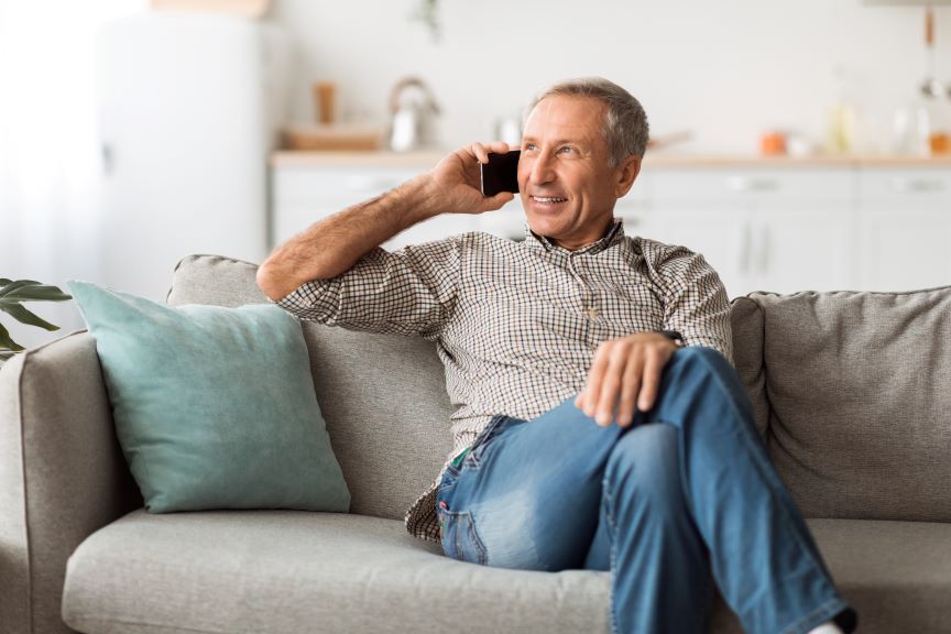 happy-senior-man-talking-on-mobile-phone-sitting-a-2022-01-05-02-39-21-utc 864x576